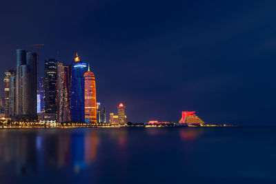 Illuminated beautiful doha skyline after sunset