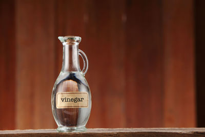 Close-up of glass bottle on table