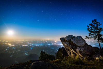 Scenic view of illuminated cityscape against sky at night