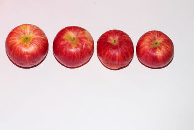 High angle view of apples against white background