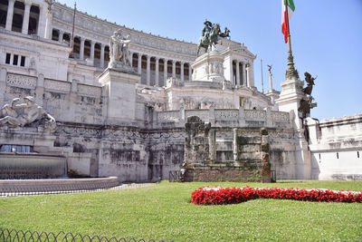 Statue in front of historic building