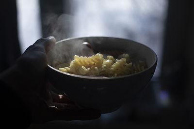 Cropped hand of person preparing food