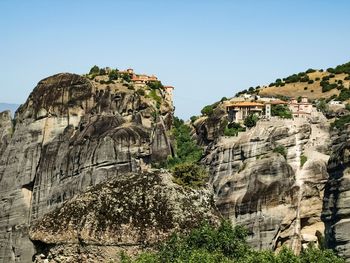 Rock formations on landscape against sky