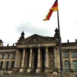 Low angle view of statues against sky