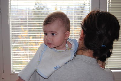 Portrait of mother and daughter at home