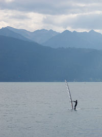 Scenic view of lake against mountain range
