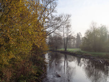 Scenic view of lake against sky during autumn