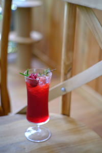 Close-up of red drink on table