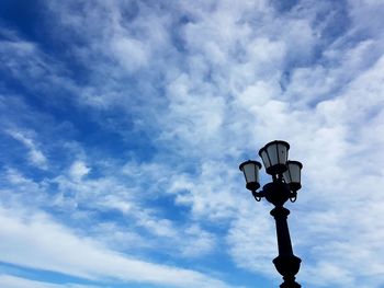 Low angle view of street light against sky