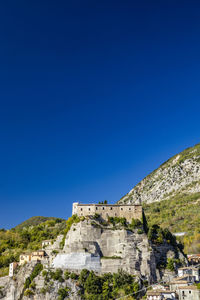 Low angle view of fort against blue sky