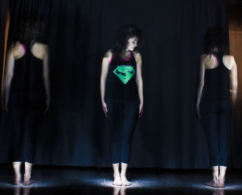 Midsection of woman standing in corridor