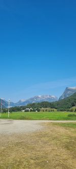 Scenic view of landscape against clear blue sky