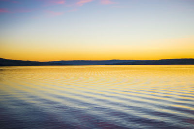 View of calm sea at sunset