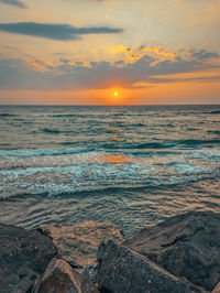 Scenic view of sea against sky during sunset