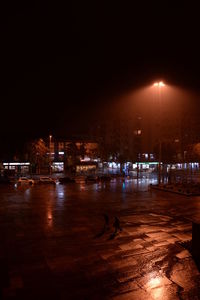 Boats in harbor at night