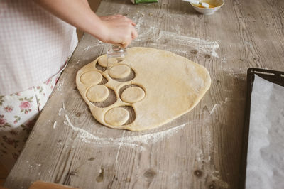 High angle view of woman baking cookies