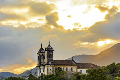 Low angle view of church against sky during sunset