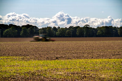 Scenic view of field against sky