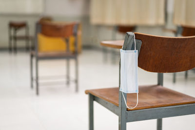 Close-up of empty chair on table