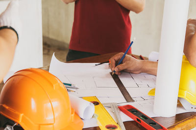 Midsection of man working at table