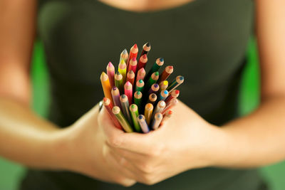 Close-up of woman hand holding flower