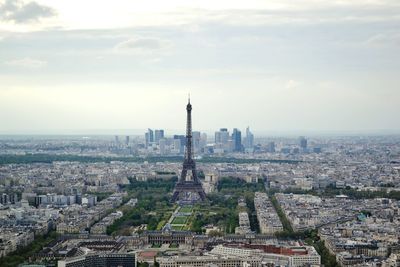 Cityscape against cloudy sky