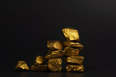 Close-up of stack of stones against black background