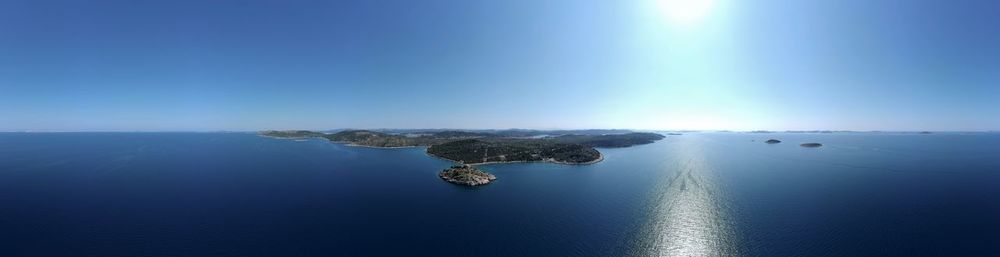 Scenic view of sea against blue sky