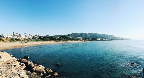 Scenic view of sea against clear blue sky