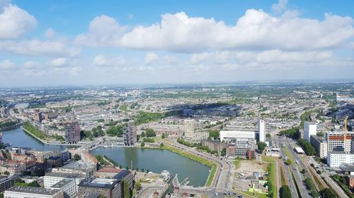 High angle view of cityscape against cloudy sky