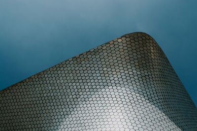 Low angle view of building against blue sky