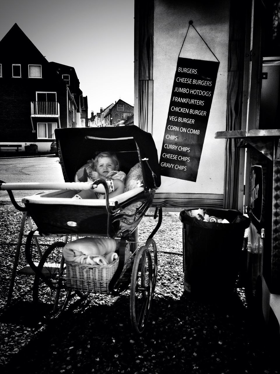 building exterior, architecture, built structure, chair, house, table, residential structure, residential building, city, day, sidewalk cafe, absence, empty, sunlight, building, no people, outdoors, window, communication, restaurant