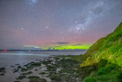 Scenic view of sea against sky at night