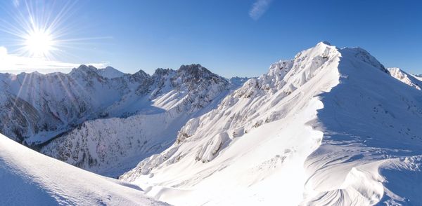 Scenic view of snowcapped mountains against sky