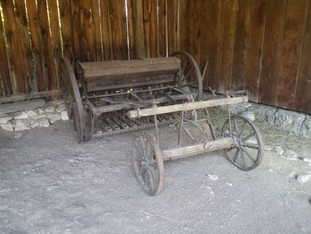 Old bicycle parked on wooden wall