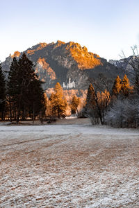 Scenic view of snow covered mountains against clear sky