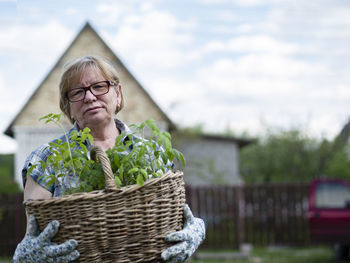 Portrait of mid adult man in basket