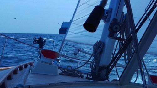 Low angle view of boats sailing in sea