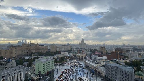 High angle view of buildings in city against sky