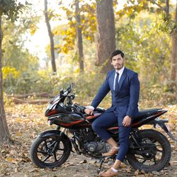 Portrait of man riding bicycle in forest