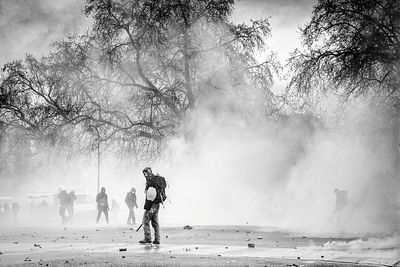 Protestors on street with smoke during riot