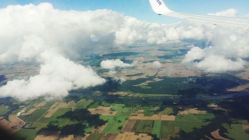 Cropped image of airplane flying over landscape