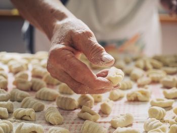 Midsection of person preparing food