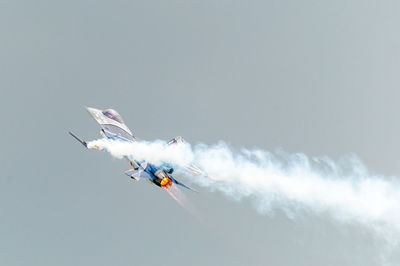 Low angle view of airplane flying against clear sky