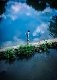 Man standing by lake