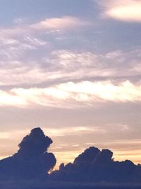 Low angle view of silhouette landscape against sky during sunset