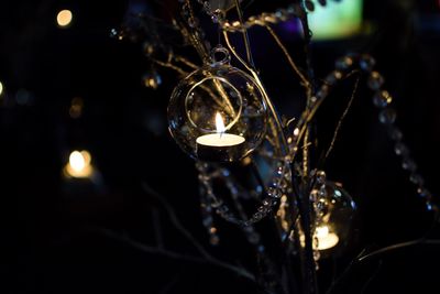 Close-up of illuminated lights at night