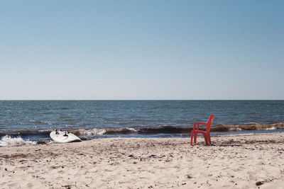 Scenic view of beach against clear sky