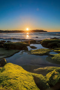 Scenic view of sea against sky during sunset