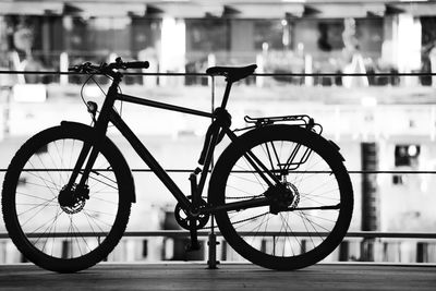Silhouette bicycle on bridge